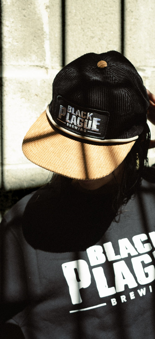 Corduroy patch hat worn with the BLACK PLAGUE Brewing crewneck