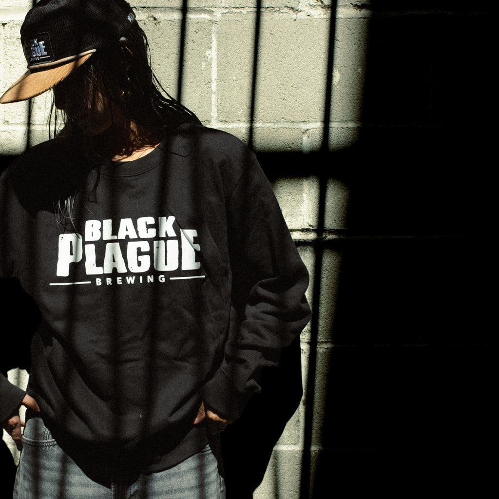 Black crewneck sweatshirt with the white BLACK PLAGUE Brewing logo